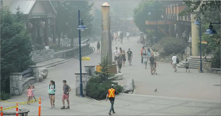  ?? PHOTOS: JASON PAYNE/PNG ?? A blanket of smoke caused by wildfires covers Whistler and the Sea-to-Sky corridor Tuesday. The air-quality health index lists the risk for Whistler at 10.