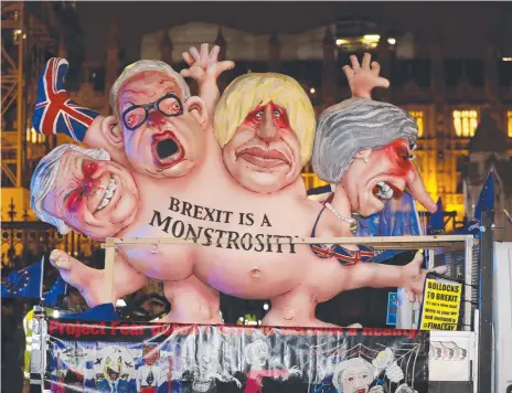  ?? Picture: AP/FRANK AUGSTEIN ?? An anti-Brexit effigy is driven around Parliament Square after the results of the vote on British Prime Minister Theresa May's Brexit deal were announced. British lawmakers rejected the deal by a huge margin.