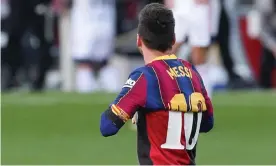  ??  ?? Lionel Messi celebrates his goal in Barcelona’s 4-0 win against Osasuna with a Newell’s Old Boys shirt emblazoned with the No 10 worn by himself and Diego Maradona. Photograph: Albert Gea/Reuters