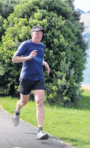  ?? PHOTO: LINDA ROBERTSON ?? New adventure ... Ultramarat­hon runner Glenn Sutton, of Dunedin, who will take part in a 617km run from Milford Sound to Dunedin, trains on shared pathway in Dunedin yesterday.