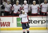  ?? BILL KOSTROUN — THE ASSOCIATED PRESS ?? Capitals left wing Alex Ovechkin celebrates his 700th career goal during the third period against the Devils on Saturday in Newark, N.J.