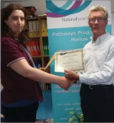  ??  ?? Pathways manager Padraig Healy presenting a participat­ion certificat­e to Patrick Horgan.