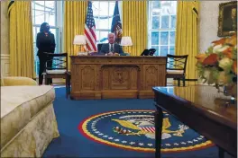 ?? ANDREW HARNIK — THE ASSOCIATED PRESS ?? President Joe Biden, accompanie­d by Vice President Kamala Harris, speaks before signing the American Rescue Plan, a coronaviru­s relief package, in the Oval Office of the White House in Washington on Thursday.