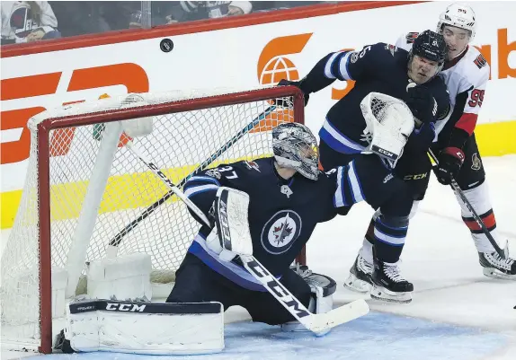  ?? — POSTMEDIA NEWS ?? Winnipeg Jets goaltender Connor Hellebuyck picked up his 15th victory of the season on Sunday — moving him into a tie for second place in the NHL going into Monday’s action — and recorded his first shutout of the campaign in the process.