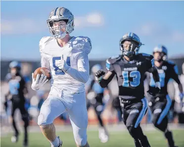  ?? ROBERTO E. ROSALES/ JOURNAL ?? La Cueva’s Connor O’Toole, left, pulls away from Cleveland defenders on his way to a touchdown during Saturday’s Class 6A football final.