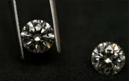  ?? Matt Rourke/Associated Press ?? A lab grown diamond, left, and a natural diamond — are chemically identical and entirely made out of carbon.