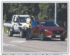  ?? Picture: Scott Radford-chisholm ?? Police at the scene of the crash on the Bruce Highway near Rollingsto­ne.