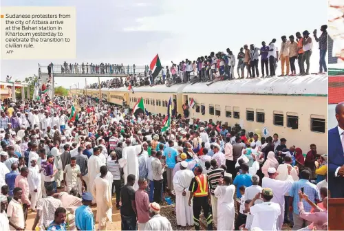  ?? AFP ?? Sudanese protesters from the city of Atbara arrive at the Bahari station in Khartoum yesterday to celebrate the transition to civilian rule.