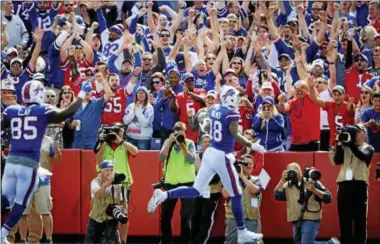  ?? ADRIAN KRAUS - THE ASSOCIATED PRESS ?? Fans cheer after Buffalo Bills’ Andre Holmes (18) scored a touchdown during the second half of an NFL football game against the New York Jets, Sunday, Sept. 10, 2017, in Orchard Park, N.Y.