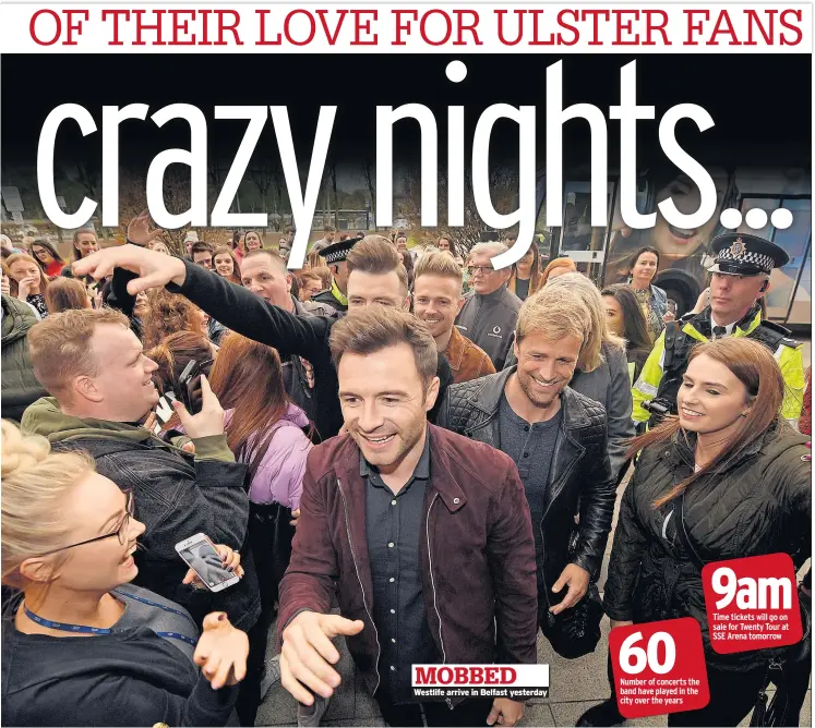  ??  ?? MOBBED Westlife arrive in Belfast yesterday