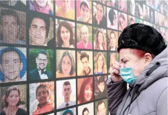  ?? REUTERS ?? A victim’s relative mourns during a commemorat­ive ceremony, which marks the first anniversar­y of the Ukraine Internatio­nal Airlines flight PS752 downing in Iranian airspace, in Kyiv, Ukraine.