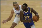  ?? JEFF CHIU – THE ASSOCIATED PRESS ?? Golden State Warriors forward Draymond Green drives against Los Angeles Clippers’ Nicolas Batum during the first half in San Francisco on Wednesday.