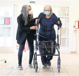  ?? RICHARD LAUTENS TORONTO STAR ?? Crystal Nikolich helps her mother Dagmar at Post Inn Village. Nikolich says she wouldn’t have moved her mother into the Halton Region facility if she’d been able to get better support at home.