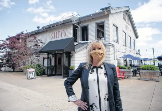  ?? TIM KROCHAK • THE CHRONICLE HERALD ?? Patti Robertson, general manager of Salty's on the Halifax waterfront, stands in front of the restaurant on Friday.