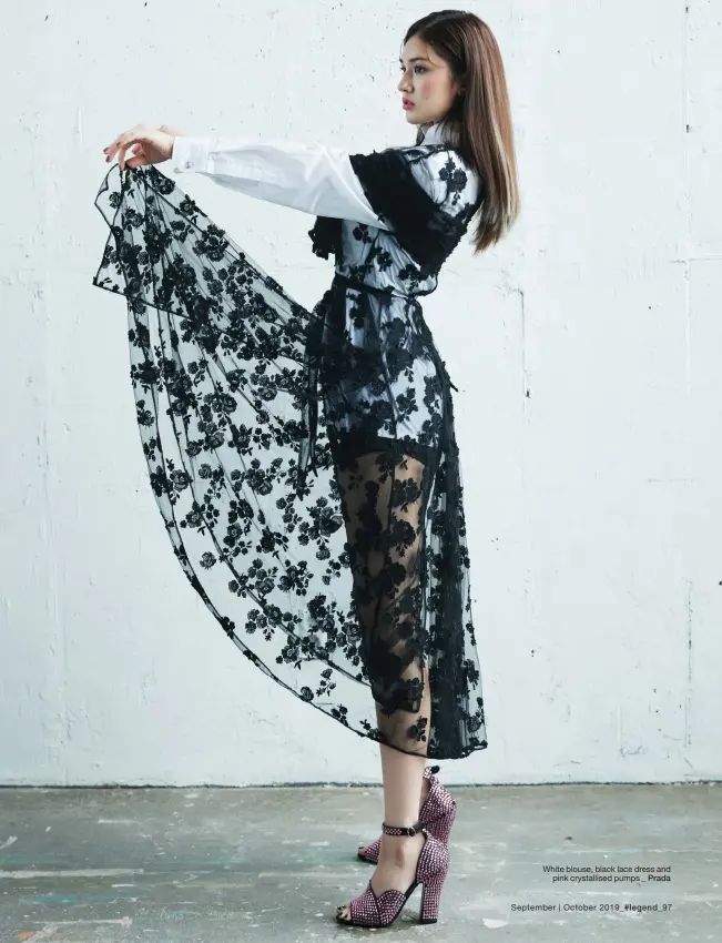  ??  ?? White blouse, black lace dress and pink crystallis­ed pumps _ Prada