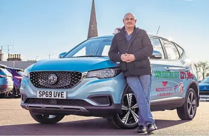  ??  ?? David Bayne with his electric MG ZS.