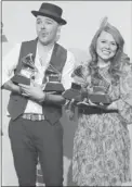  ?? STEVE MARCUS/ REUTERS ?? Jesse & Joy pose with their four awards during the Latin Grammy Awards in Las Vegas.