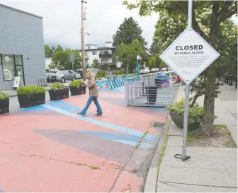  ?? MIKE BELL ?? Vancouver is looking to convert some side streets into temporary plazas, like this area on East 14th Avenue near Main Street, which is closed to vehicular traffic during the COVID-19 pandemic.