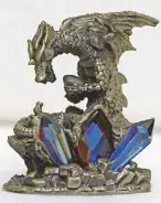  ??  ?? Stone dragon with precious crystals