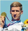  ?? Foto: Weiken, dpa ?? Gold über 10 Kilometer im Freiwasser: Florian Wellbrock.