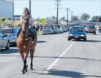  ?? Photo: FAIRFAX NZ ?? Tribute: A racehorse leads the hearse away after the funeral service for jockey Ashlee Mundy held at the Solid Energy Centre in Westport yesterday.