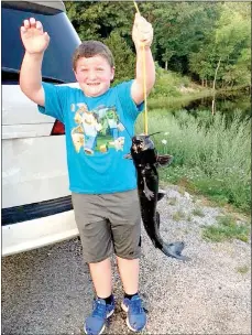  ?? Submitted photo ?? Seven-year-old Carter Musteen’s first catch was also his second catch. He was fishing for trout at Lake Brittany when he caught this catfish — twice.