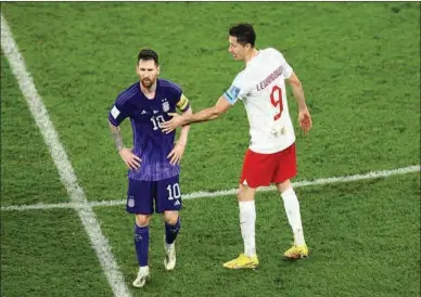  ?? PIC:GETTY IMAGES ?? Tense:
Lewandowsk­i’s attempt at a handshake was blanked by Messi