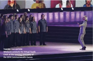  ?? Taking the baton: ?? Whitacre conducts his Virtual Youth Choir at the opening ceremony of the 2014 Commonweal­th Games