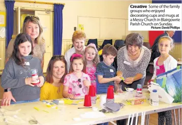  ??  ?? Creative Some of the family groups who enjoyed decorating cups and mugs at a Messy Church in Blairgowri­e Parish Church on Sunday.