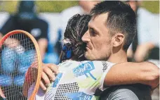  ?? ?? Bernard Tomic embracing Skander Mansouri after their battle in Mexico. Picture: ATP Challenger Tour/Instagram