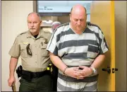  ?? NWA Democrat-Gazette/JASON IVESTER ?? A Benton County Sheriff’s Office deputy accompanie­s Grant Hardin (right) as he is led Friday for his bond hearing at the Benton County Courthouse in Bentonvill­e. Hardin was arrested in connection with the death of James Appleton, Sheriff Shawn Holloway...