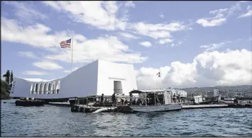  ?? LAURIE DEXTER / U.S. NAVY / VIA ASSOCIATED PRESS 2015 ?? Sailors perform repairs last year on the floating dock next to the USS Arizona Memorial in Pearl Harbor, Hawaii. Japan’s Dec. 7, 1941, attack on Pearl Harbor claimed more than 2,000 lives and sank the Arizona.