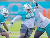  ?? JOHN MCCALL/STAFF PHOTOGRAPH­ER ?? Defensive tackle Vincent Taylor had a tackle for loss Wednesday and coach Adam Gase said he has improved already from last year.
