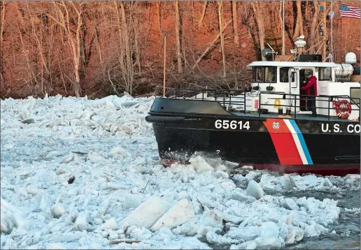  ?? DANA JENSEN/THE DAY ?? The Coast Guard cutter Bollard plows through the ice as seen from the cutter Hawser as both work the frozen Connecticu­t River on Thursday.