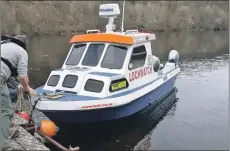  ??  ?? LochWatch’s patrol boat ready to save lives on Loch Awe.