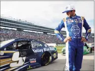  ?? Jared C. Tilton / Getty Images ?? Chase Elliott, driver of the No. 9 Kelley Blue Book Chevrolet, stands on the grid after the NASCAR Cup Series Autotrader EchoPark Automotive 500 at Texas Motor Speedway on Sunday.