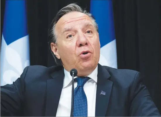  ?? THE CANADIAN PRESS/JACQUES BOISSINOT ?? Quebec Premier Francois Legault responds to reporters during a news conference on the COVID-19 pandemic, Friday, April 17, 2020 at the legislatur­e in Quebec City.