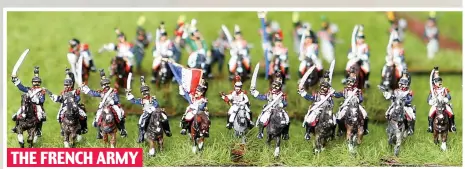  ??  ?? THE FRENCH ARMY Napoleon’s heavy cavalry – cuirassier­s – charge into battle, their swords drawn, bearing the French standard