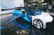  ?? Photo: Bloomberg ?? AeroHT’s concept electric vertical take-off and landing vehicle goes on display at the Auto China show in Beijing.