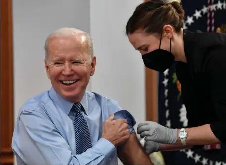  ?? Getty imAgeS ?? SOME PROTECTION: President Biden gets his second COVID booster shot late last month. A growing number of people in Biden’s inner circle have tested positive for the virus.