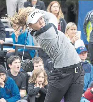  ?? FRED CHARTRAND THE CANADIAN PRESS ?? Canadian golfer Brooke Henderson takes part in a clinic for juniors Tuesday during a charity golf tournament in Dunrobin, Ont. She later talked about the LPGA and gave kids advice.