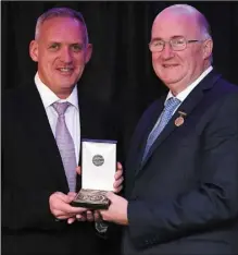  ??  ?? Colm Corrigan, left, of LMFM with the award for Best GAA related Radio Programme for LMFM’s “When Sam crossed the Boyne”, with Uachtarán Chumann Lúthchleas Gael John Horan presenting the award.