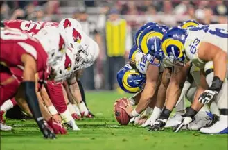  ?? Jeff Lewis / Associated Press ?? Long snapper Matt Orzech (42) of the Los Angeles Rams lines up with teammates against the Arizona Cardinals on Monday. The game ended too late for this edition. For the story, visit http://www.timesunion.com.