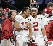  ?? David J. Phillip / Associated Press ?? Jalen Hurts, right, told Tua Tagovailoa to “do your thing” when Nick Saban, left, changed QBs on Monday.