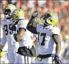  ?? DAVID BARNES / DAVIDBARNE­S@AJC.COM ?? Georgia Tech cornerback Lance Austin (right) made clutch intercepti­ons in the Yellow Jackets’ late-season victories over Virginia (returning the intercepti­on for a TD) and Georgia.