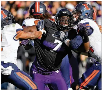  ?? JONATHAN DANIEL / GETTY IMAGES ?? Ifeadi Odenigbo finished his Northweste­rn career with 23½ sacks and led the Big Ten with 10 last season, but his name wasn’t called until the seventh round of the NFL draft.