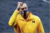  ?? AJ MAST — THE ASSOCIATED PRESS ?? U-M head coach Juwan Howard celebrates as he walks off the court after a second-round game against LSU.