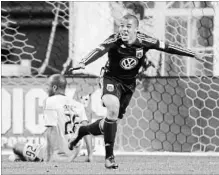  ?? ASSOCIATED PRESS FILE PHOTO ?? D.C. United's Charlie Davies, right, reacts after scoring a goal against the Columbus Crew's Julius James (26) during the second half of a Major League Soccer game in Washington in March 2011.