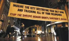  ?? Michael Macor / The Chronicle ?? The Coalition on Homelessne­ss holds a demonstrat­ion at the Powell Street cable car turnaround — a campout to protest the city’s tent sweeps.