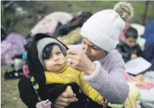  ??  ?? Lica izbjegličk­e djece s grčko-turske granice